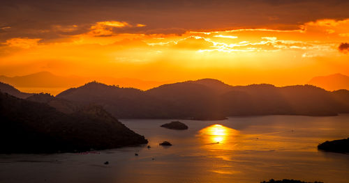 Scenic view of sea against orange sky