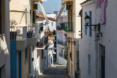 High angle view of footpath amidst buildings in town