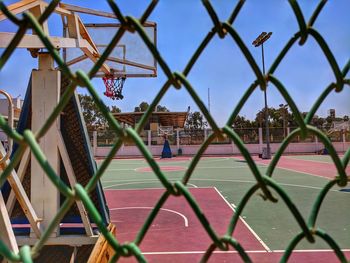 Chainlink fence against blue sky