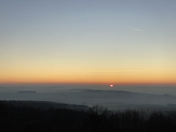 Scenic view of silhouette landscape against sky during sunset