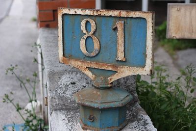 Close-up of number 81 on metal