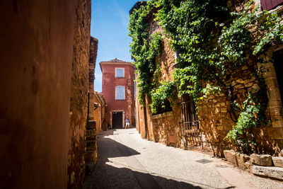 Street amidst buildings against sky