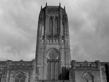 Low angle view of cathedral against cloudy sky