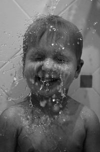 Close-up of baby boy having bath