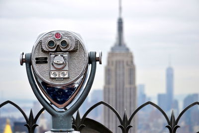 Coin operated binoculars and new york city sky