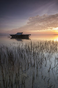 Scenic view of sea against sky during sunset