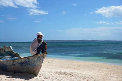 Man on beach against sky