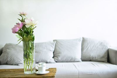 White flower vase on table at home