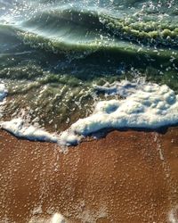 High angle view of surf on beach