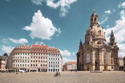 Panoramic view of buildings in city against sky