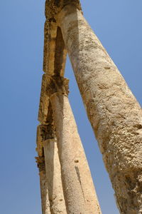 Low angle view of old ruin against sky