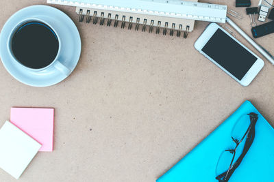 High angle view of coffee cup on table