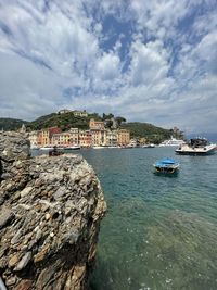 Scenic view of sea and buildings against sky