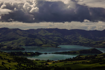 Scenic view of lake and mountains against sky