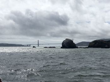 Bridge over sea against sky
