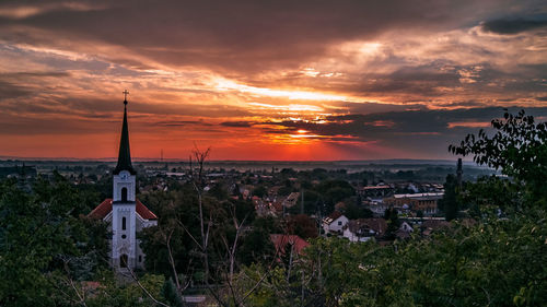 Panoramic view of townscape against sky during sunset