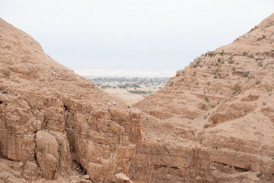 Scenic view of arid landscape against sky