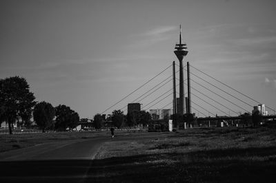 Road by city against sky