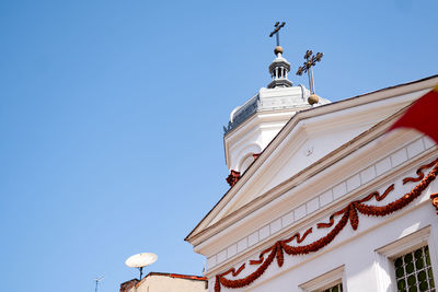 Low angle view of building against clear blue sky