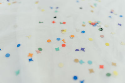 High angle view of multi colored candies on table