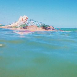 Scenic view of sea against blue sky