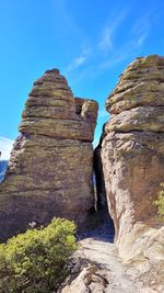 Low angle view of rock formation against sky