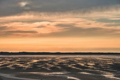 Scenic view of landscape against sky during sunset