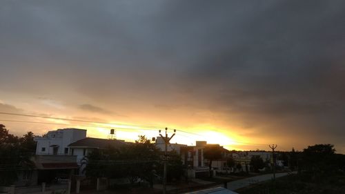 Built structure against cloudy sky at sunset