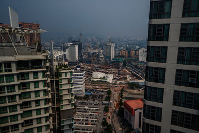 High angle view of buildings in city against sky