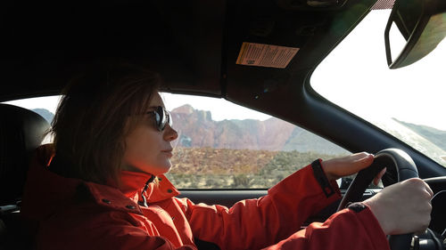 Portrait of woman sitting in car