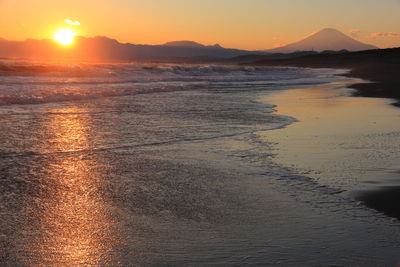 Scenic view of sea against sky during sunset