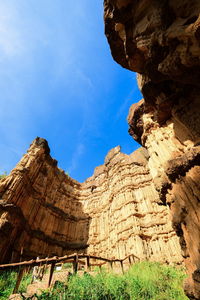 Low angle view of rock formation against sky