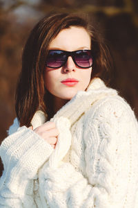 Portrait of woman in sunglasses during winter