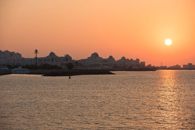 Scenic view of sea against clear sky during sunset