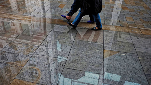 Low section of man walking on footpath