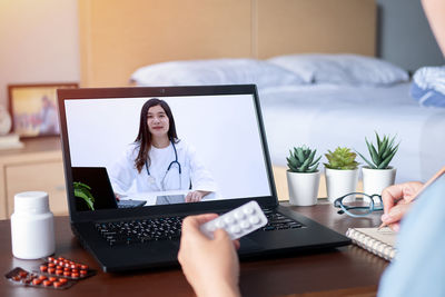 Woman using laptop on table