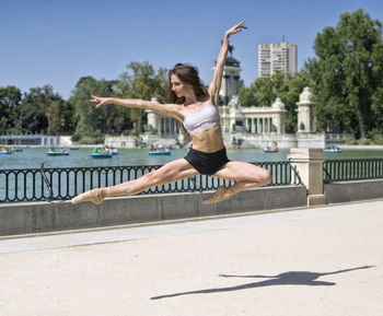 Amazing ballerina pose outdoors dancing, lifestyle concept.