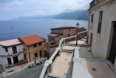 High angle view of townscape by sea