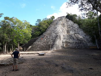 Man standing in front of historical building