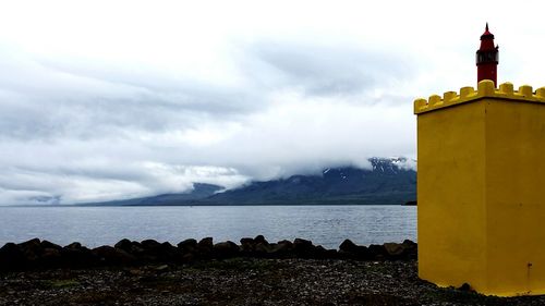 Scenic view of sea against cloudy sky