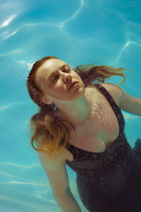 Woman swimming in pool