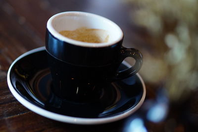 Close-up of coffee cup on table