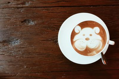 Directly above shot of coffee cup on table