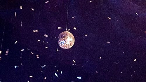 Low angle view of christmas decoration hanging on ceiling