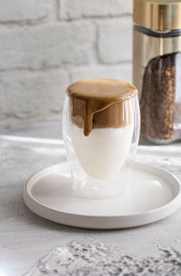 Close-up of coffee cup on table