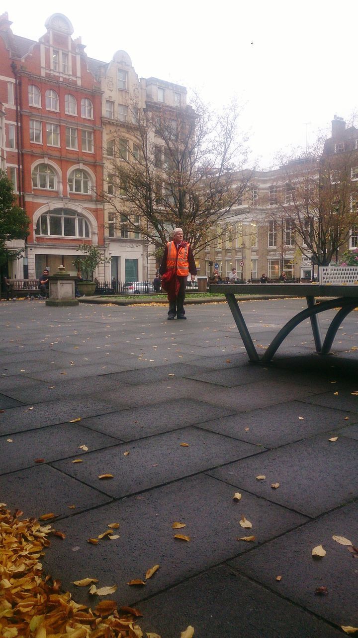 WOMAN WALKING IN CITY