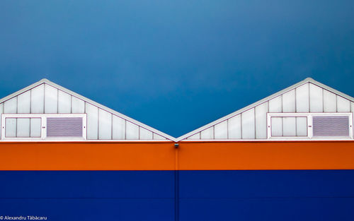 Low angle view of building against blue sky