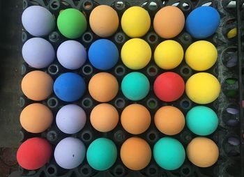 High angle view of multi colored eggs