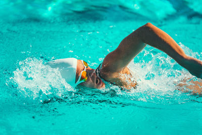 Female athlete swimming in pool