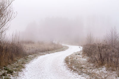 Scenic view of landscape against sky during winter